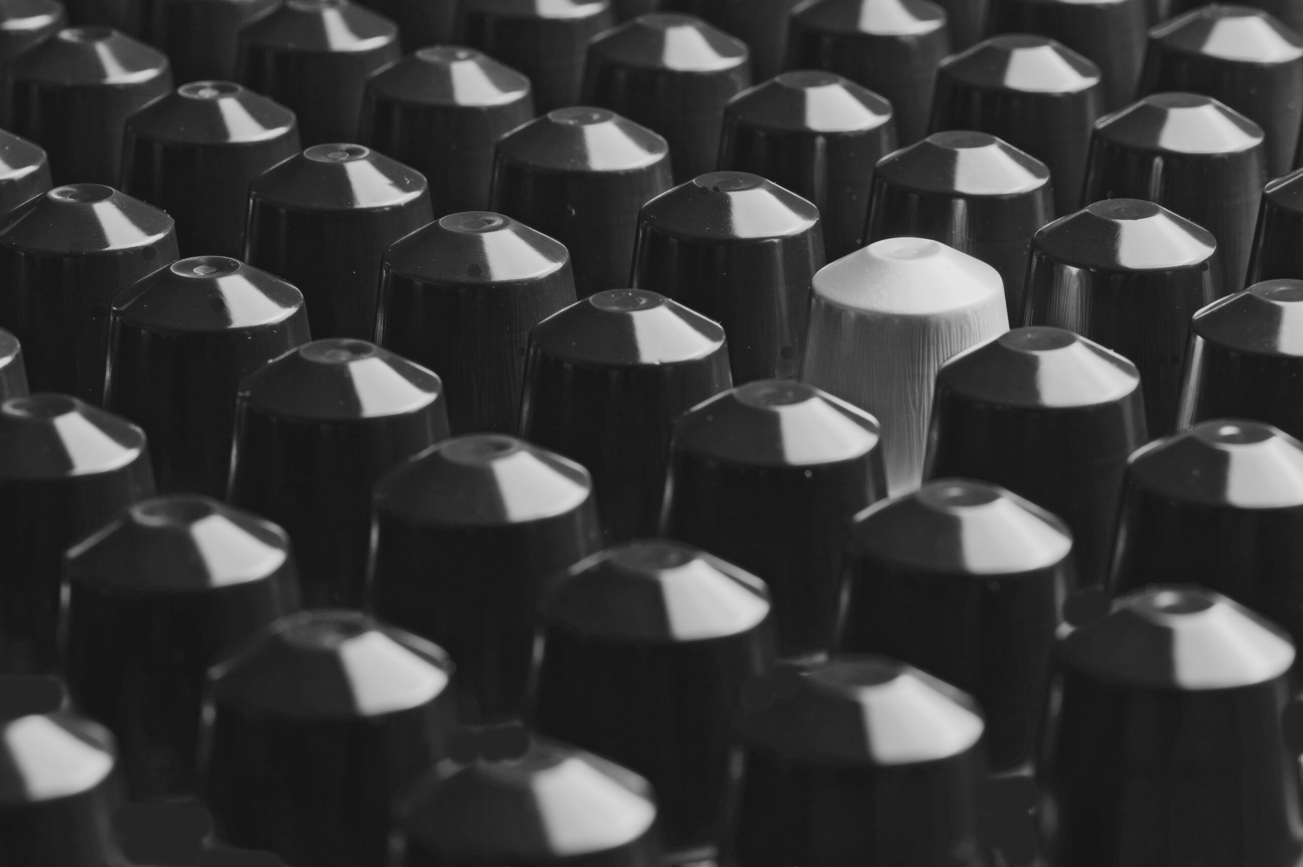 Coffee capsules arranged in a repeated pattern